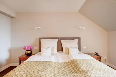 Ein Bett oder Betten in einem Zimmer der Unterkunft Hotel Admiral