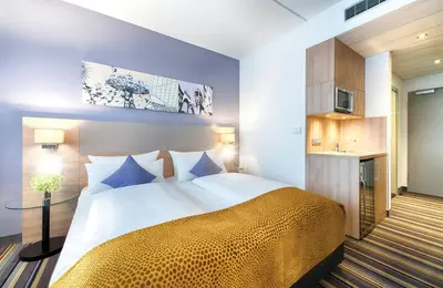Ein Bett oder Betten in einem Zimmer der Unterkunft Leonardo Hotel Munich City North