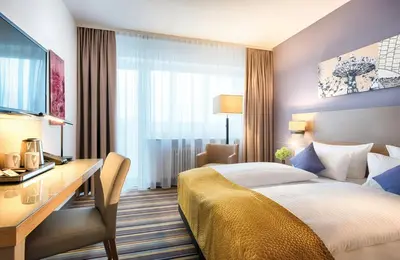 Ein Bett oder Betten in einem Zimmer der Unterkunft Leonardo Hotel Munich City North