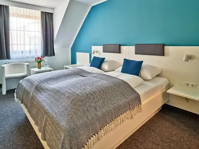 Ein Bett oder Betten in einem Zimmer der Unterkunft Brunnenhof City Center