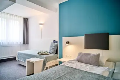 Ein Bett oder Betten in einem Zimmer der Unterkunft Brunnenhof City Center