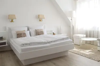 Ein Bett oder Betten in einem Zimmer der Unterkunft Boutique Hotel Krone München