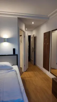 Ein Bett oder Betten in einem Zimmer der Unterkunft Hotel Aurbacher Hof GmbH