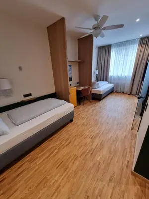 Ein Bett oder Betten in einem Zimmer der Unterkunft myMINGA13 - Hotel & serviced Apartments
