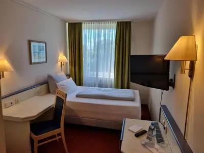 Ein Bett oder Betten in einem Zimmer der Unterkunft myMINGA13 - Hotel & serviced Apartments