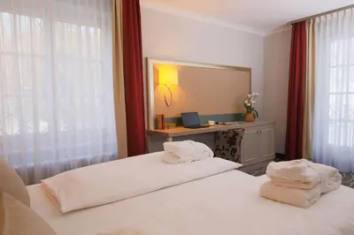 Ein Bett oder Betten in einem Zimmer der Unterkunft Hotel Bayerischer Hof Miesbach, BW Premier Collection