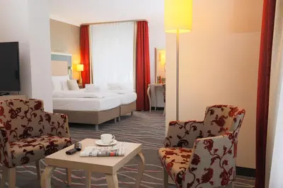 Ein Bett oder Betten in einem Zimmer der Unterkunft Hotel Bayerischer Hof Miesbach, BW Premier Collection