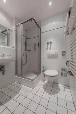 Ein Badezimmer in der Unterkunft Hotel Royal
