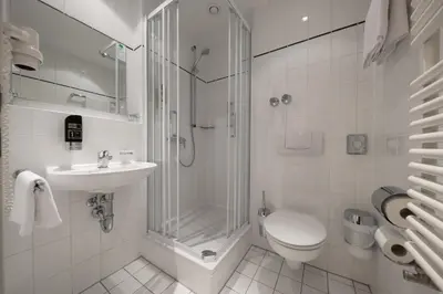 Ein Badezimmer in der Unterkunft Hotel Royal