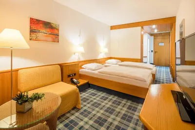 Ein Bett oder Betten in einem Zimmer der Unterkunft Hotel Am Nockherberg