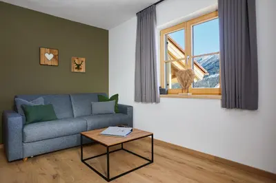 Ein Sitzbereich in der Unterkunft Landhaus Herzogsteig