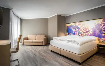 Ein Bett oder Betten in einem Zimmer der Unterkunft AWA Hotel