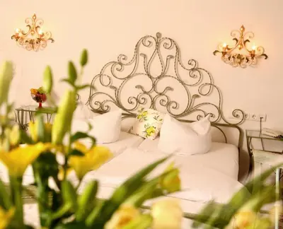 Ein Bett oder Betten in einem Zimmer der Unterkunft Seibel's Park Hotel