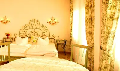 Ein Bett oder Betten in einem Zimmer der Unterkunft Seibel's Park Hotel