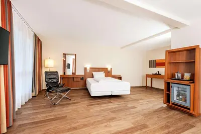 Ein Bett oder Betten in einem Zimmer der Unterkunft NH München Ost Conference Center