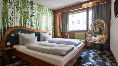 Ein Bett oder Betten in einem Zimmer der Unterkunft Cocoon Stachus