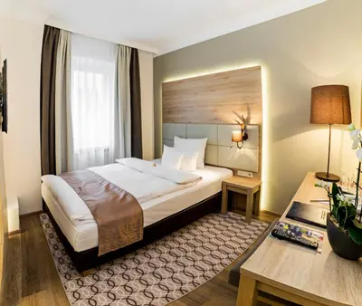 Ein Bett oder Betten in einem Zimmer der Unterkunft Drei Loewen