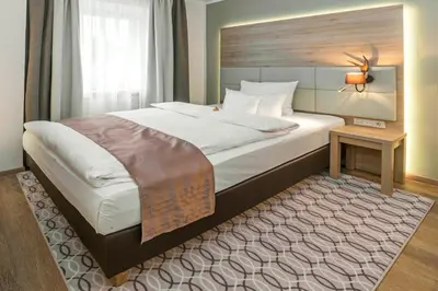 Ein Bett oder Betten in einem Zimmer der Unterkunft Drei Loewen