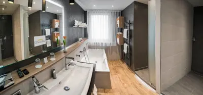 Ein Badezimmer in der Unterkunft Drei Loewen