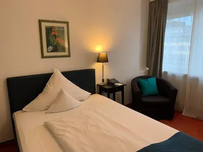 Ein Bett oder Betten in einem Zimmer der Unterkunft Hotel Nymphenburg City - München