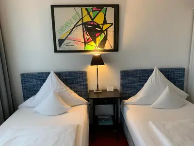 Ein Bett oder Betten in einem Zimmer der Unterkunft Hotel Nymphenburg City - München