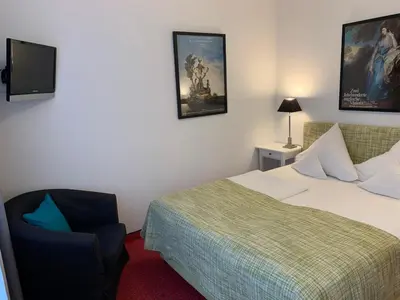 Ein Bett oder Betten in einem Zimmer der Unterkunft Hotel Nymphenburg City - München