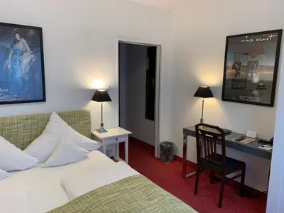 Ein Bett oder Betten in einem Zimmer der Unterkunft Hotel Nymphenburg City - München