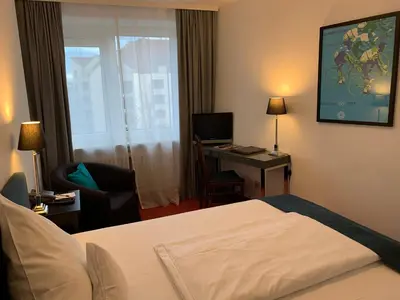 Ein Bett oder Betten in einem Zimmer der Unterkunft Hotel Nymphenburg City - München