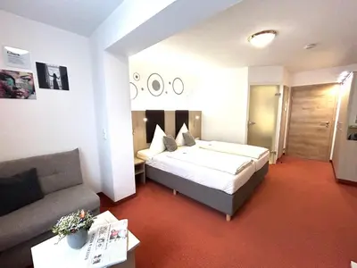Ein Bett oder Betten in einem Zimmer der Unterkunft Würmtaler Gästehaus