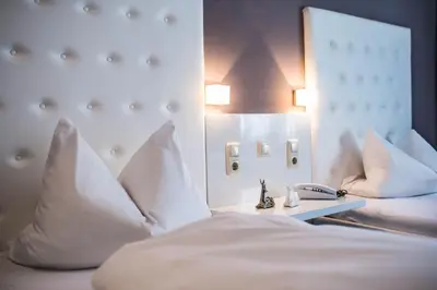 Ein Bett oder Betten in einem Zimmer der Unterkunft Hotel Domizil
