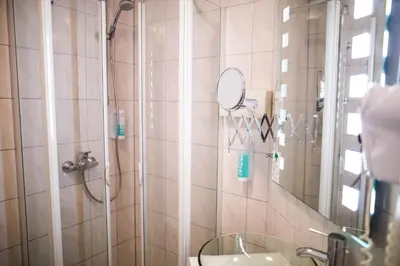 Ein Badezimmer in der Unterkunft Hotel Domizil