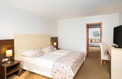 Ein Bett oder Betten in einem Zimmer der Unterkunft QU Hotel, Trademark Collection by Wyndham