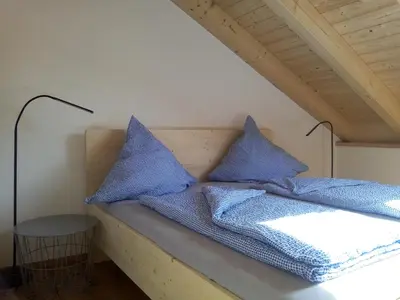 Ein Bett oder Betten in einem Zimmer der Unterkunft Ferienwohnung Seidlpark im Haus Ecker