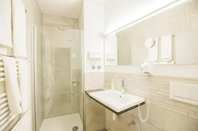 Ein Badezimmer in der Unterkunft Hotel Am Turm