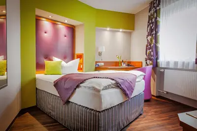 Ein Bett oder Betten in einem Zimmer der Unterkunft Hotel Am Turm