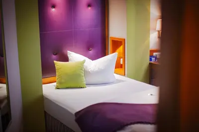 Ein Bett oder Betten in einem Zimmer der Unterkunft Hotel Am Turm