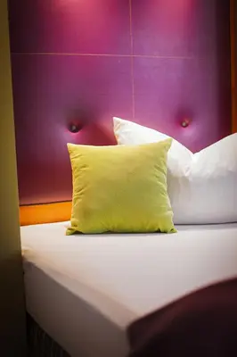 Ein Bett oder Betten in einem Zimmer der Unterkunft Hotel Am Turm
