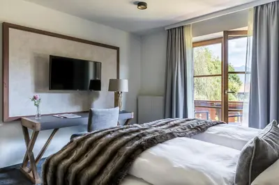 Ein Bett oder Betten in einem Zimmer der Unterkunft Alpenhof Murnau