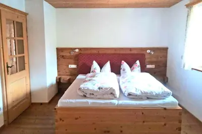 Ein Bett oder Betten in einem Zimmer der Unterkunft Bergbauernhof Simmerl