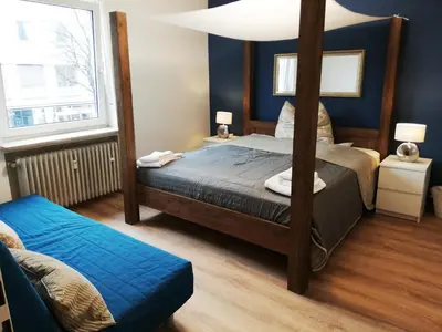 Ein Bett oder Betten in einem Zimmer der Unterkunft Moderne Wohnungen am Bahnhof Dachau mit direkter S-Bahn Verbindung nach München