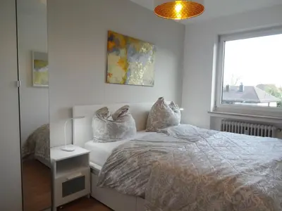 Ein Bett oder Betten in einem Zimmer der Unterkunft Moderne Wohnungen am Bahnhof Dachau mit direkter S-Bahn Verbindung nach München