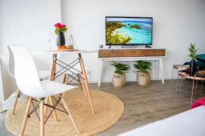 TV/Unterhaltungsangebot in der Unterkunft Modernes Apartment mit tollem Blick über die Stadt
