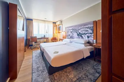 Ein Bett oder Betten in einem Zimmer der Unterkunft Arthotel Ana im Olympiapark