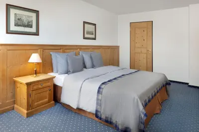 Ein Bett oder Betten in einem Zimmer der Unterkunft Arabella Alpenhotel am Spitzingsee, a Tribute Portfolio Hotel