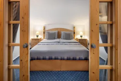 Ein Bett oder Betten in einem Zimmer der Unterkunft Arabella Alpenhotel am Spitzingsee, a Tribute Portfolio Hotel