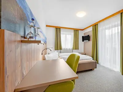 Ein Bett oder Betten in einem Zimmer der Unterkunft Landhotel Gabriele