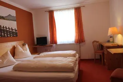 Ein Bett oder Betten in einem Zimmer der Unterkunft Zum Goldenen Schwanen