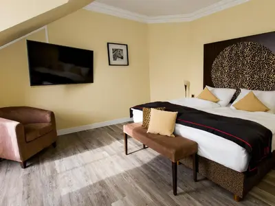 Ein Bett oder Betten in einem Zimmer der Unterkunft DORMERO Hotel München-Kirchheim Messe