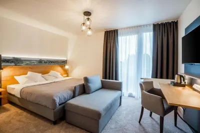 Ein Bett oder Betten in einem Zimmer der Unterkunft MEAT UND STAY Hotel