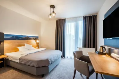 Ein Bett oder Betten in einem Zimmer der Unterkunft MEAT UND STAY Hotel